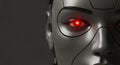 Close-up of a robotic face with glowing red eyes, futuristic technology. Royalty Free Stock Photo