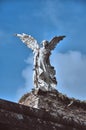 04-09-2012 Comillas, Spain - Winged Angel Sculpture with Sword in Comillas Cemetery