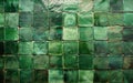 A striking arrangement of green tiles, with varying shades and textures that come together in a cohesive, visually