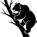 Black silhouette of a bear climbing a tree with sharp claws Royalty Free Stock Photo