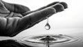 Water Drop Falling from Hand into Clean Surface, Symbolizing Conservation Royalty Free Stock Photo