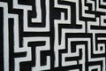 A striking composition of geometric patterns in bright white, sharply contrasting against a deep Ai ganerated