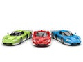 Striking concept super cars in red, green and blue base colors with white details - top view Royalty Free Stock Photo