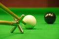 Striking the cue ball with a short rest Royalty Free Stock Photo