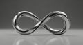 Sleek Chrome Infinity Symbol on Reflective Grey Background Royalty Free Stock Photo