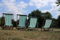 Striking deckchairs in the Hyde Park in the city London.