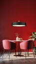 A striking dining niche featuring a black pendant light, a round wooden table, and plush pink velvet chairs, all set Royalty Free Stock Photo