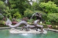 A striking fountain made of granite and bronze, in the form of a dragon in the Butchart Garden Royalty Free Stock Photo