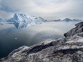 Glacial ice mountain Ilulissat Icefjord in Greenland. Dramatic sun halo over glacier at the Sermeq Kujalleq sea mouth