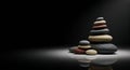 Zen rock stack reflecting harmony in darkness Royalty Free Stock Photo