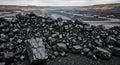 Huge coal deposit pile at open pit mine site Royalty Free Stock Photo