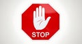 Red octagonal stop sign with white hand icon Royalty Free Stock Photo
