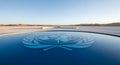 United Nations Logo Reflected in a Pristine Water Surface with Desert Landscape Royalty Free Stock Photo