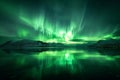 A striking image of a green aurora borealis illuminating the night sky over a serene lake, with majestic mountains in the Royalty Free Stock Photo