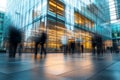 A striking image of a large office building, with a motion blur effect capturing the busy flow of