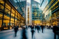 A striking image of a large office building, with a motion blur effect capturing the busy flow of