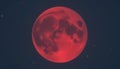 A striking image of the Moon, appearing red due