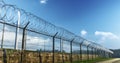 The Striking Image of a New Fence Capped with Barbed Wire Royalty Free Stock Photo