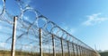 The Striking Image of a New Fence Capped with Barbed Wire Royalty Free Stock Photo