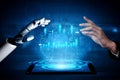 Futuristic robotic hand and human hand reaching for digital data visualization on a tablet, showcasing collaboration Royalty Free Stock Photo