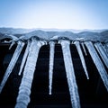 Close-up of Icicles Hanging from a Roofline Royalty Free Stock Photo
