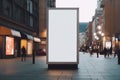 Striking outdoor advertising mockup, blank vertical billboard on city street Royalty Free Stock Photo