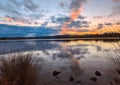 Striking sky stretching across the water and mountains Royalty Free Stock Photo