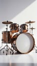 A complete drum set with copper-colored shells and white drumheads stands on a reflective white surface under bright lighting Royalty Free Stock Photo