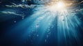 Bright Sunbeams and Rising Bubbles in Deep Blue Water Royalty Free Stock Photo