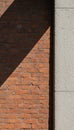 Textured Brick Wall with Diagonal Shadow and Concrete Royalty Free Stock Photo