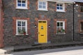 Striking yellow door in the village Dingle in county Kerry in Ireland in the summer.