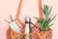 String bag with reusable water bottle and metal straws, go green and use no single use plastic Royalty Free Stock Photo