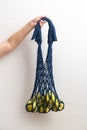 String bag, a wicker bag made of rope with apples in women