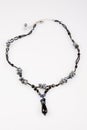 String beads black necklace on white background