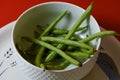 String beans seeds closeup on isolated red background