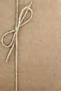 String Bow on Brown Paper Royalty Free Stock Photo