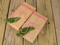 String and brown paper parcels decorated with conifer and check Royalty Free Stock Photo