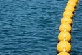 String of Buoys Floating on Ocean Surface Royalty Free Stock Photo