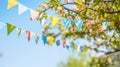 string of colorful pennant against blue sky in the garden Royalty Free Stock Photo