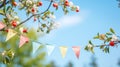 string of colorful pennant against blue sky in the garden Royalty Free Stock Photo