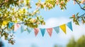 string of colorful pennant against blue sky in the garden Royalty Free Stock Photo