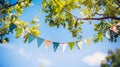 string of colorful pennant against blue sky in the garden Royalty Free Stock Photo