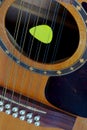 12-string electro-acoustic guitar, and pick Royalty Free Stock Photo