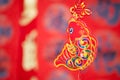 A string of lantern ornaments hung before the red spring couplets.The Chinese character on the lantern means `good luck` Royalty Free Stock Photo