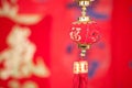 A string of lantern ornaments hung before the red spring couplets.The Chinese character on the lantern means `good luck` Royalty Free Stock Photo