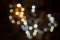Bokeh Effect with Yellow and White String Lights on Dark Background Royalty Free Stock Photo