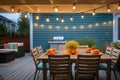 string lights draped above a patio dining set Royalty Free Stock Photo