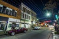 String lights hung over Dauphin Street, and buildings in downtown Mobile, Alabama