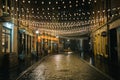 String lights on a rainy night on Stone Street, Manhattan, New York