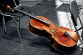 a string musical instrument of a symphony orchestra the cello lies on the theater stage Royalty Free Stock Photo